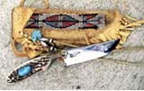Deer stag, big morenci turquoise, old fashioned tying.. The sheathe is a piece of art,deerskin, with large beaded strip ( 11/0 beads)) and turqoise bear, streling siver beads.