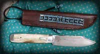 Traditionel couteau de trappeur , manche en os et etain.