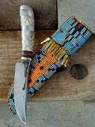 Old style, deer handle, pewter inlay and pommel, brass guard, Rawhide beaded sheath. (10/0 beads)
