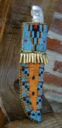 Old style, deer handle, pewter inlay and pommel, brass guard, Rawhide beaded sheath. (10/0 beads)