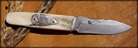 Patch knife en os, pointe de fleche en argent massif, Etui en rawhide perlé.
