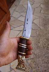 Scagel knife, 100% repro, Brass guard, leather strips; brass & micarta spacers, Wapiti stag.